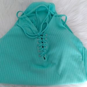 One piece swimsuit w/adjustable straps. Criss-cross straps in back. Size 12/14
